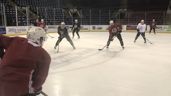 Members of the Arizona Coyotes look on during a morning skate in Kelowna Saturday. This evening, they’ll play the Vancouver Canucks.