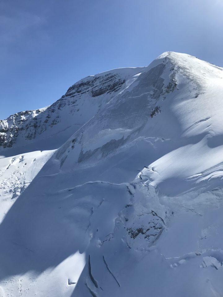 Two people climbing a mountain in Jasper National Park survived being swept up in an avalanche on Wednesday, Parks Canada said.