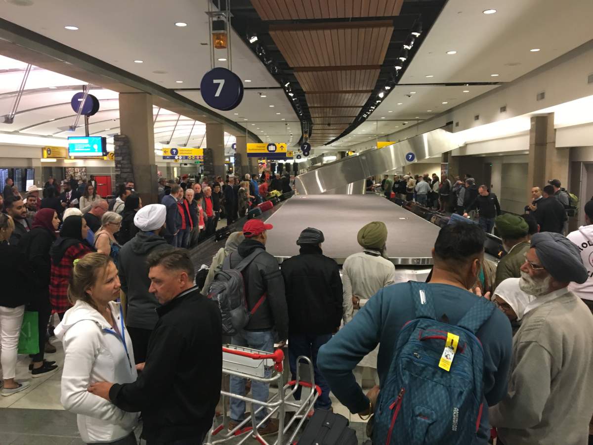British Airways passengers arrive in Calgary after being stranded in Iqaluit due to ‘fumes event’ - image