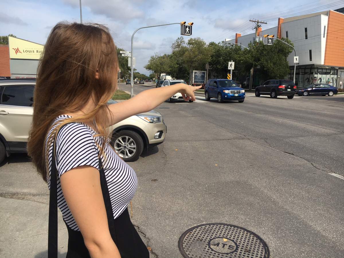Emily Wyman points the to spot where a cabbie kicked her out of the car after she refused to pay him cash for an ‘off-meter’ ride.