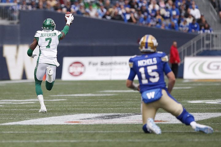 Winnipeg Blue Bombers quarterback Matt Nichols (15) looks on as Saskatchewan Roughriders' Willie Jefferson (7) runs for the touchdown after intercepting Nichols' pass during first half CFL action in the 15th annual Banjo Bowl in Winnipeg Saturday, September 8, 2018.