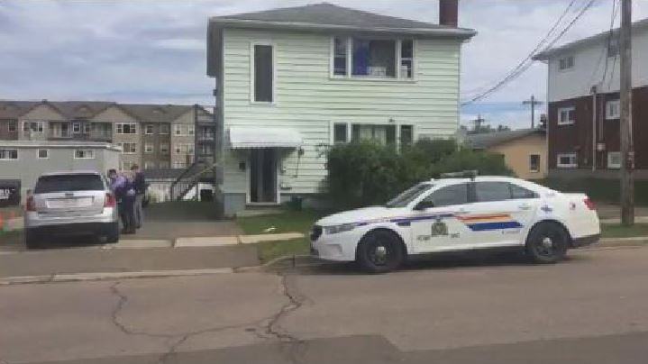 RCMP investigators hold the scene on West Lane in Moncton after the discovery of a body in September 2018 .