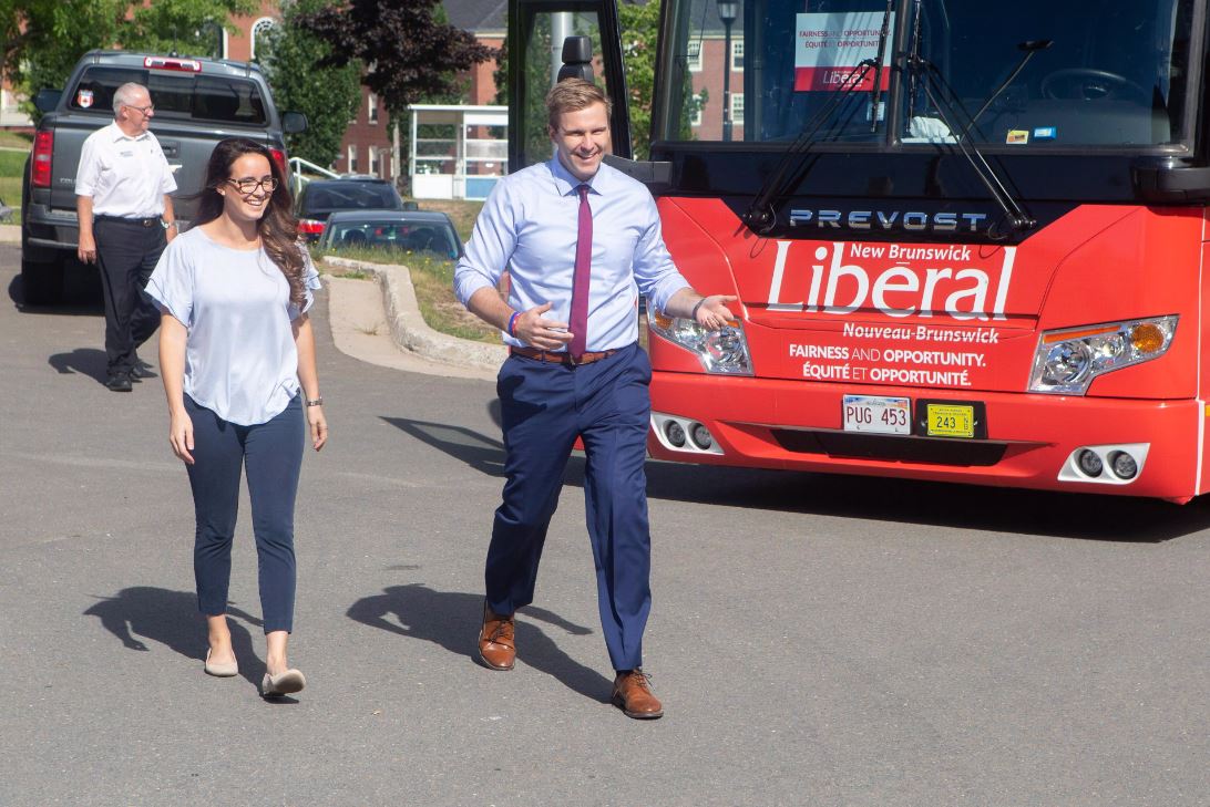 New Brunswick Liberal Leader Brian Gallant, right, and wife Karine Lavoie arrive at a campaign stop in Fredericton on Wednesday, Sept. 5, 2018. 