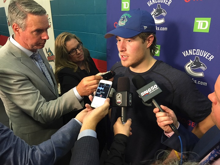 Brock Boeser of the Vancouver Canucks fields questions from the media following a 4-1 loss to the Arizona Coyotes in Kelowna, B.C., on Saturday night.