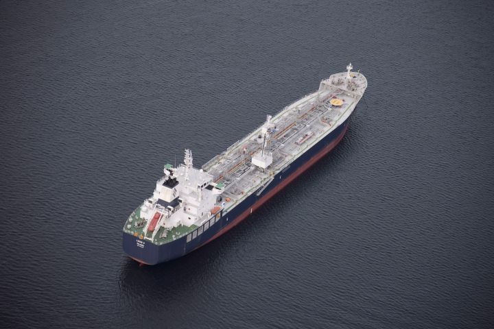 A tanker is anchored in Burrard Inlet just outside of Burnaby, B.C., on Friday, Nov. 25, 2016. The president of the company proposing the $16-billion Eagle Spirit Pipeline says his project could win regulatory endorsement if the federal government backs down on its plan to ban oil tanker traffic on the north coast of B.C. 