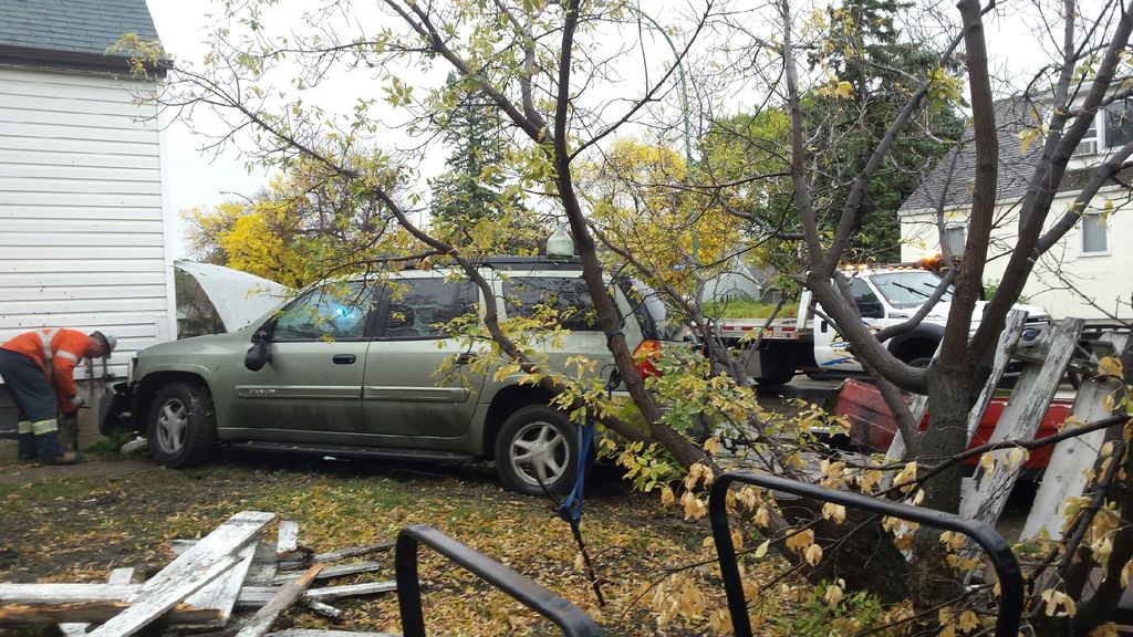 An SUV towing a trailer hit a Regina home Saturday.