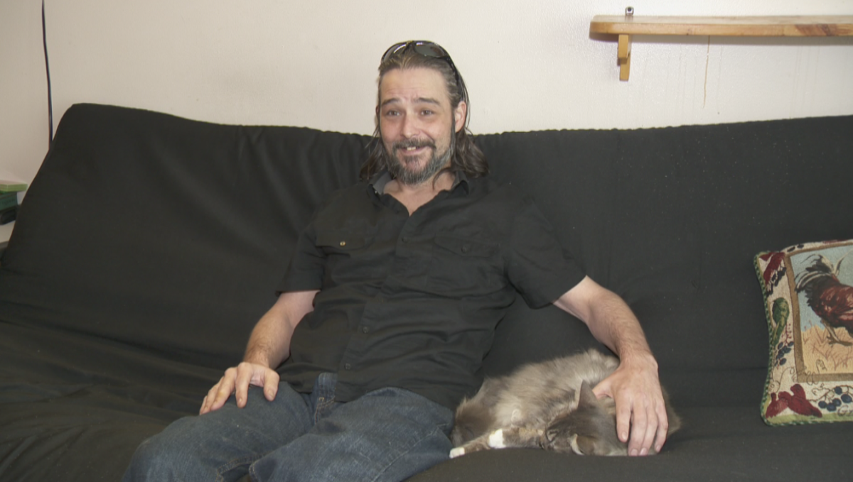 Shawn Bell and his cat burglar housemate, Bella.