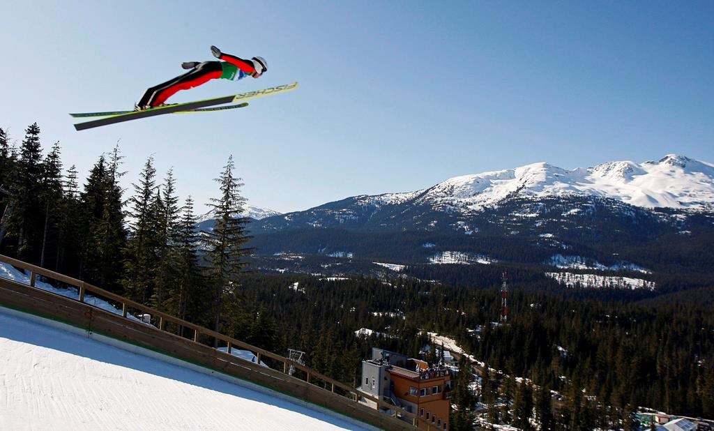 Roman Koudelka, of the Czech Republic, soars through the sky during the team ski jumping competition at Whistler Olympic Park at the 2010 Vancouver Olympic Winter Games, Monday, Feb. 22, 2010. The bid corporation Calgary 2026 proposes to re-use the 2010 ski jumping venue in Whistler, B.C., but there's resistance in Calgary to giving Olympic events to another province. THE CANADIAN PRESS/Jeff McIntosh.