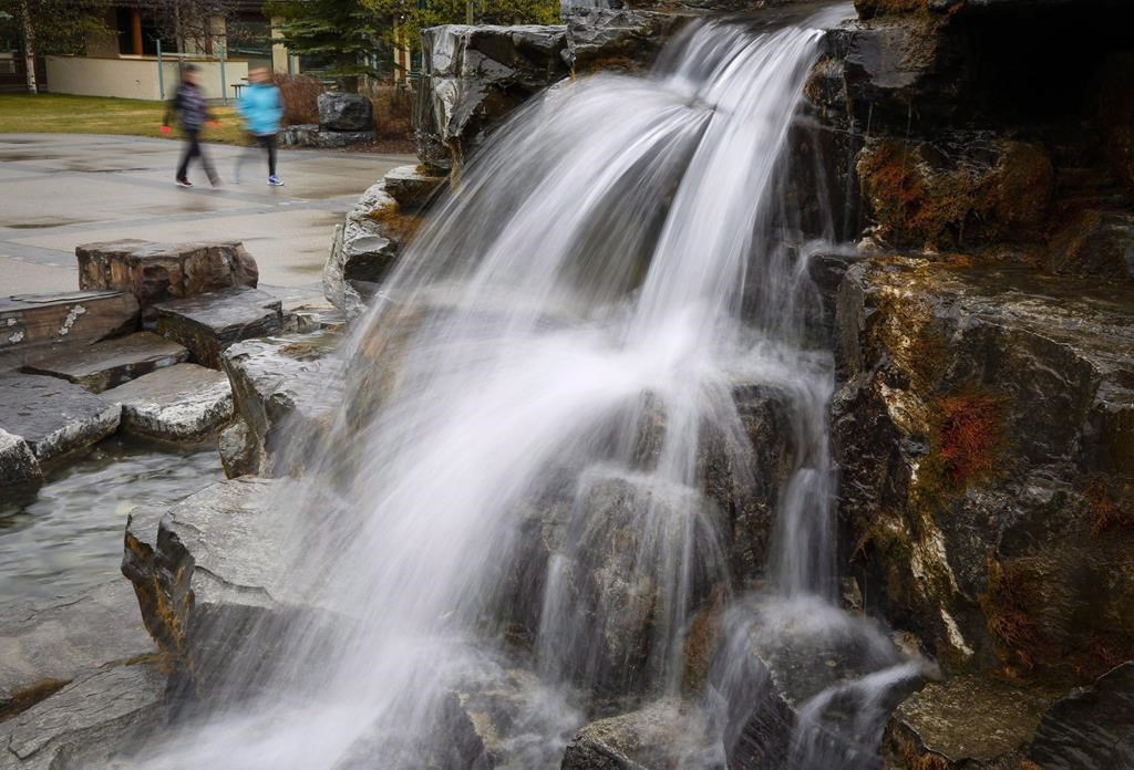 Tourists explore the resort in Kananaskis, Alta., Monday, April 25, 2016. THE CANADIAN PRESS/Jeff McIntosh.