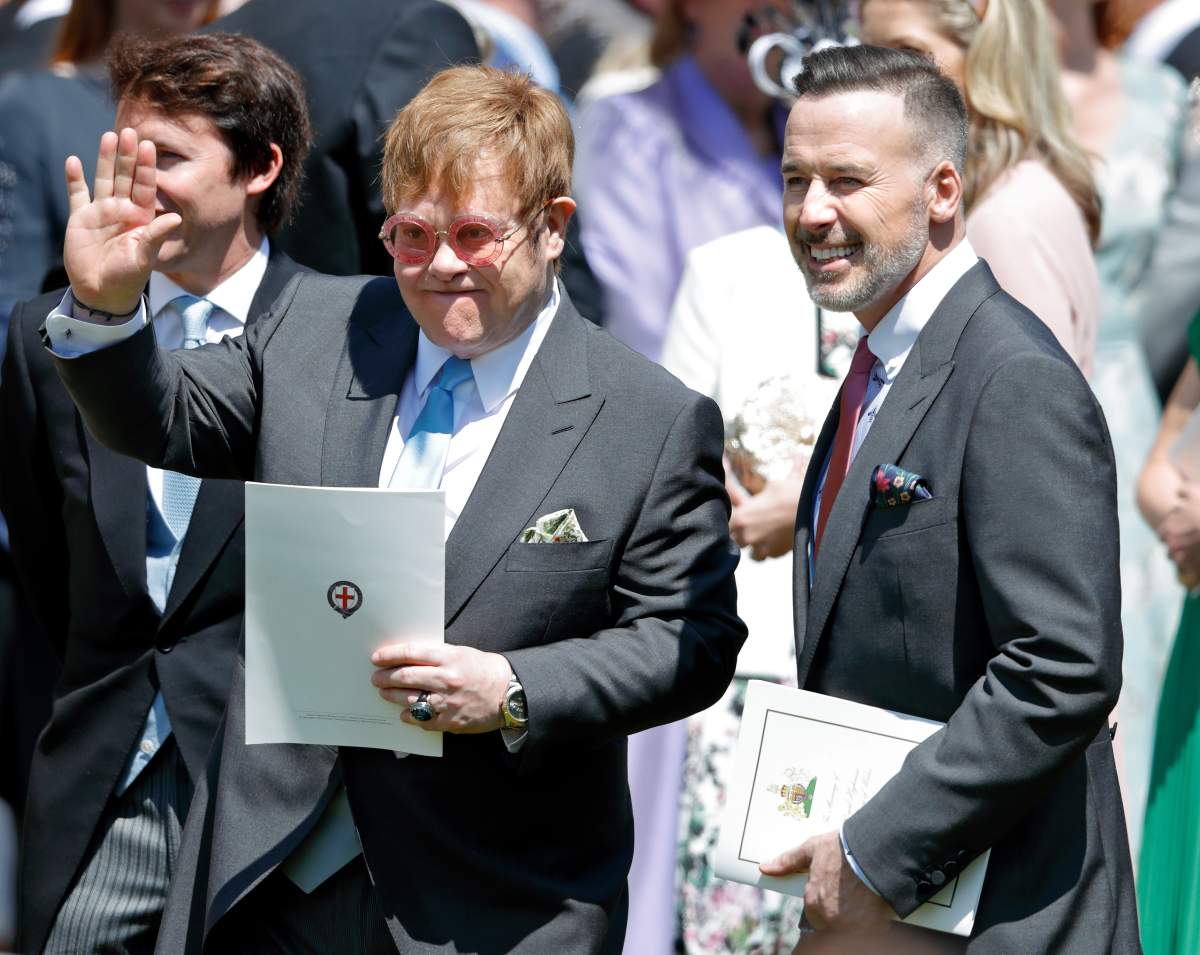Elton John and David Furnish attend the wedding of Prince Harry to Meghan Markle at St George’s Chapel, Windsor Castle on May 19, 2018 in Windsor, England.