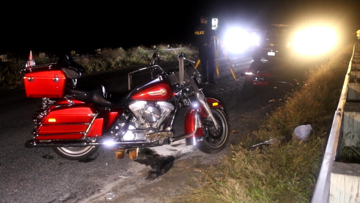 One person is dead and another suffered major leg injuries following a collision between a motorcycle and car in Port Hope on Saturday night.