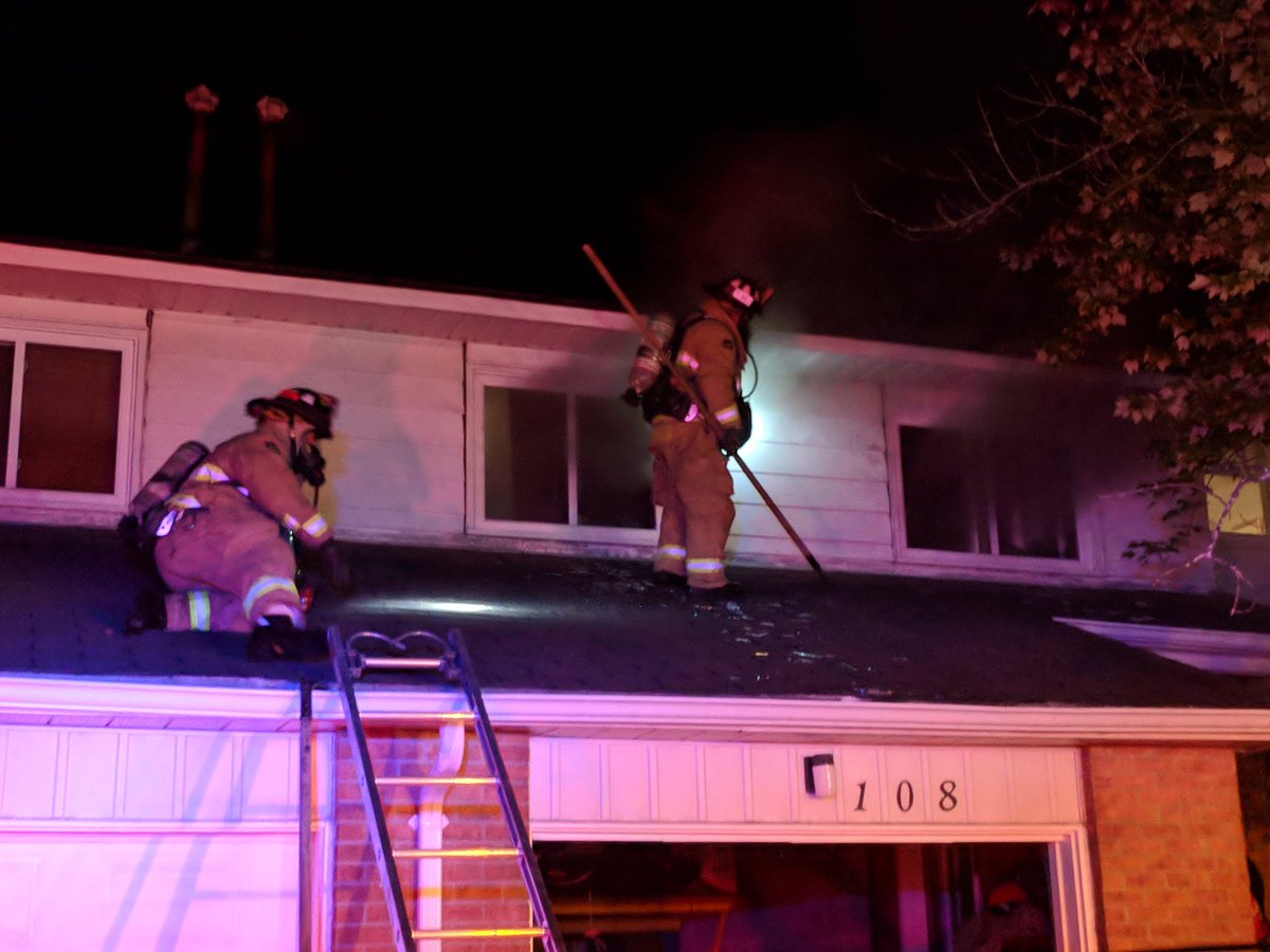Ottawa fire fighters battle a blaze in a row home at 108 The Rockery Private in Vanier on Sunday night.