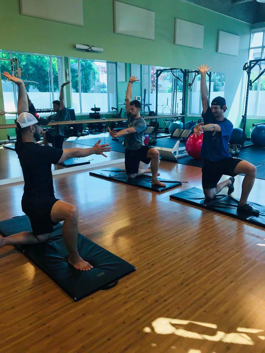 Connor Hellebuyck and Laurent Brossoit training in the off season.