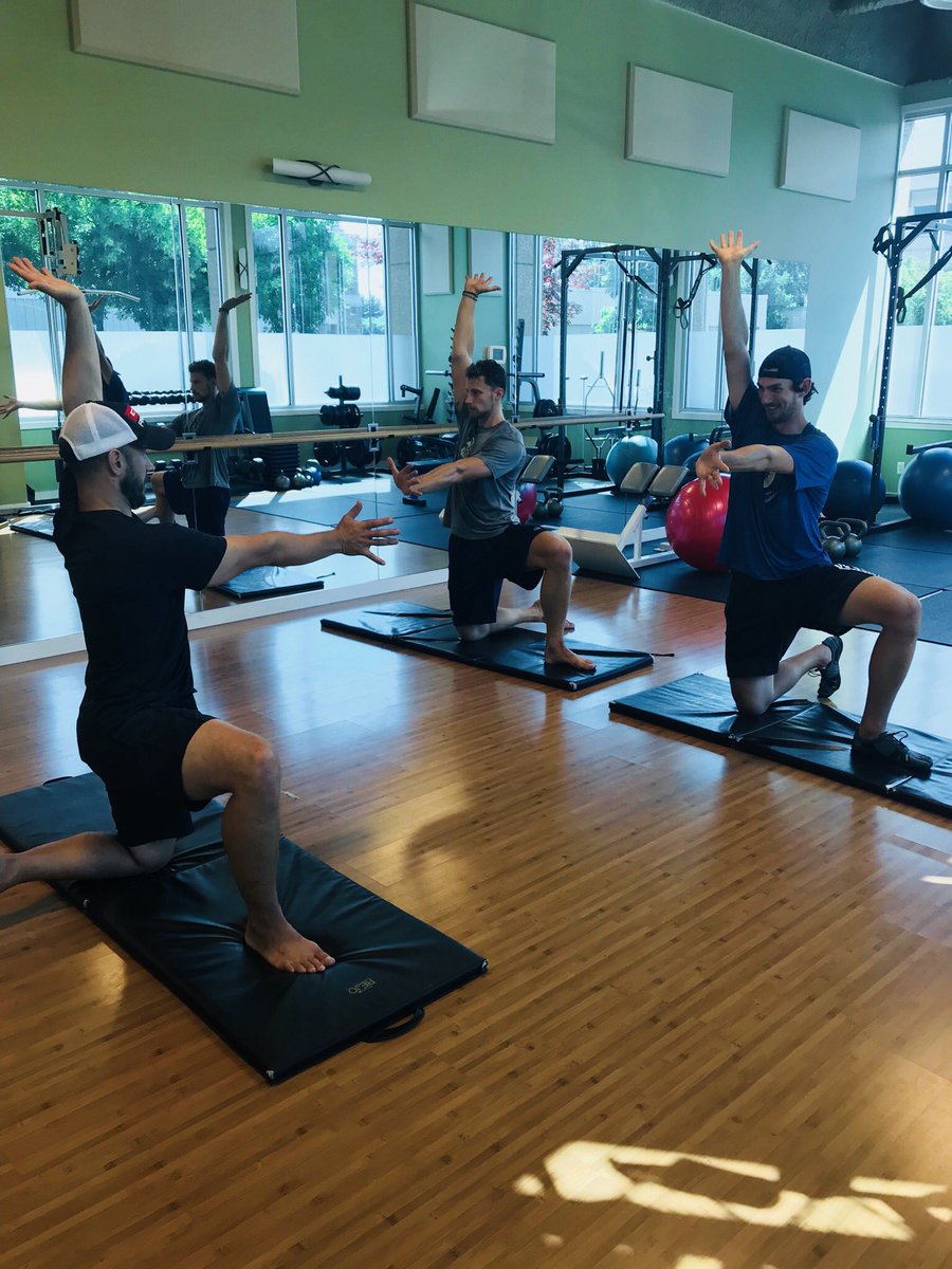 Connor Hellebuyck and Laurent Brossoit training in the off season.