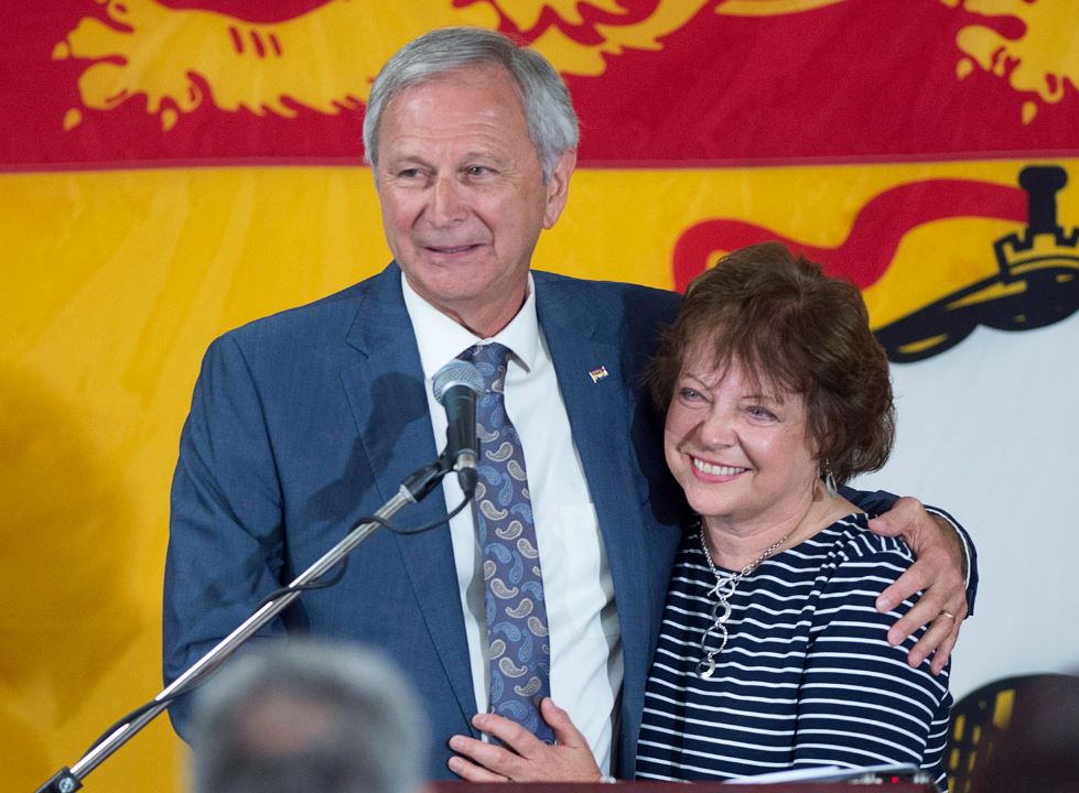 New Brunswick Progressive Conservative leader and Premier-elect Blaine Higgs embraces his wife Marcia as he addresses supporters at his campaign headquarters in Quispamsis, N.B., on Monday, Sept. 24, 2018.