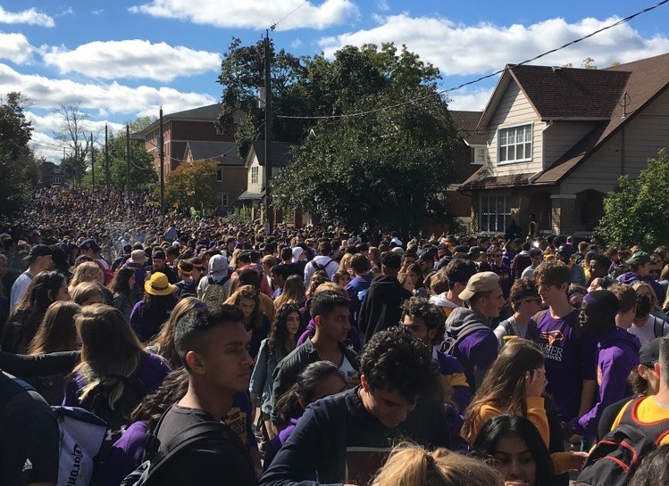 Thousands of people were on Ezra Avenue near Laurier University Saturday as a part of homecoming celebrations.