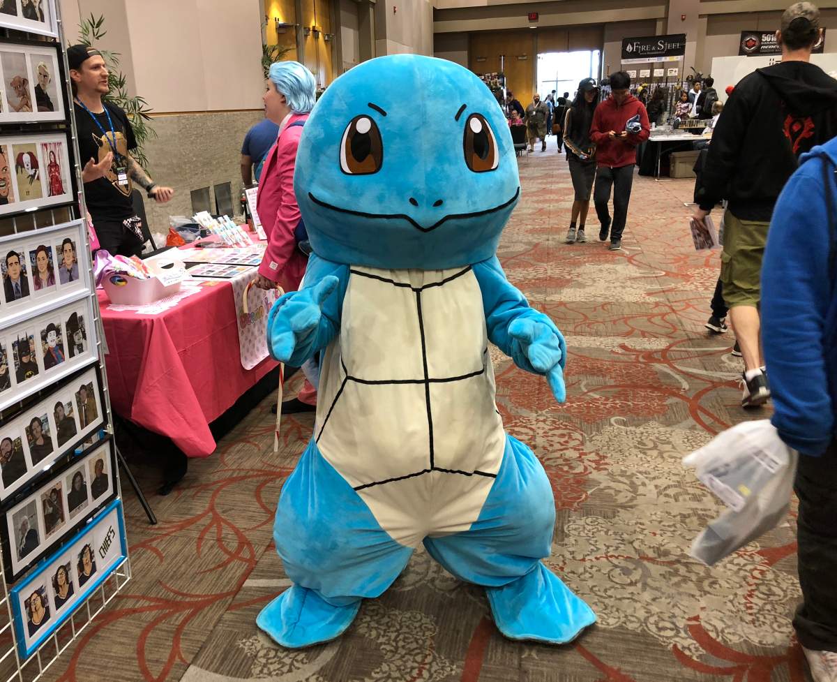 The water type Pokémon, Squirtle, poses for a photo at Forest City ComiCon.