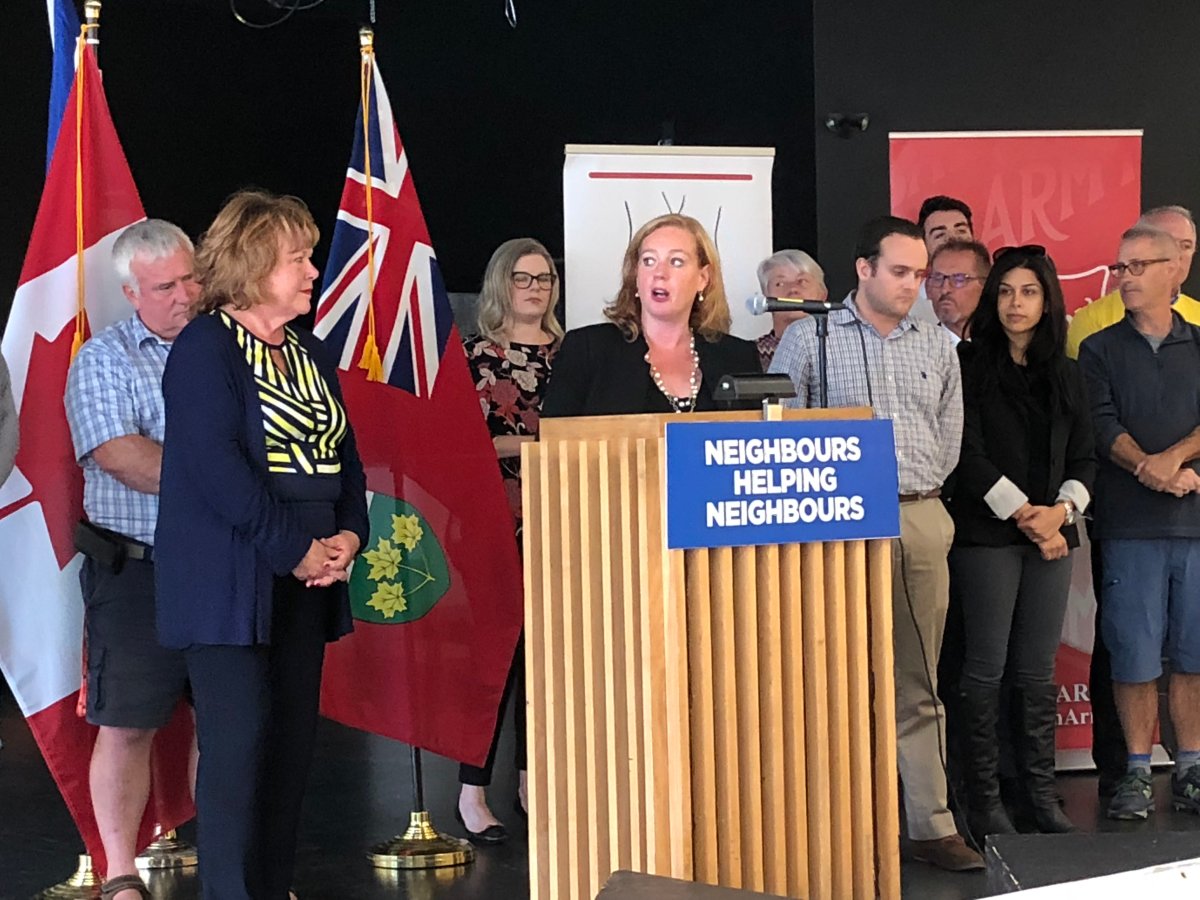Lisa MacLeod, Coun. Jan Harder and other dignitaries were on hand at the Walter Baker Centre on Friday to announce a large donation from three local groups to help with tornado relief efforts.
