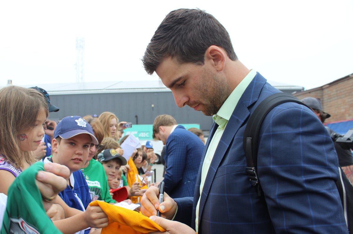 John Tavares will wear blue and white with the Toronto Maple Leafs for the first time at tonight's pre-season game in Lucan, the winning Kraft Hockeyville community. He gave plenty of autographs Tuesday morning, including a signature on a jersey for Taylor.