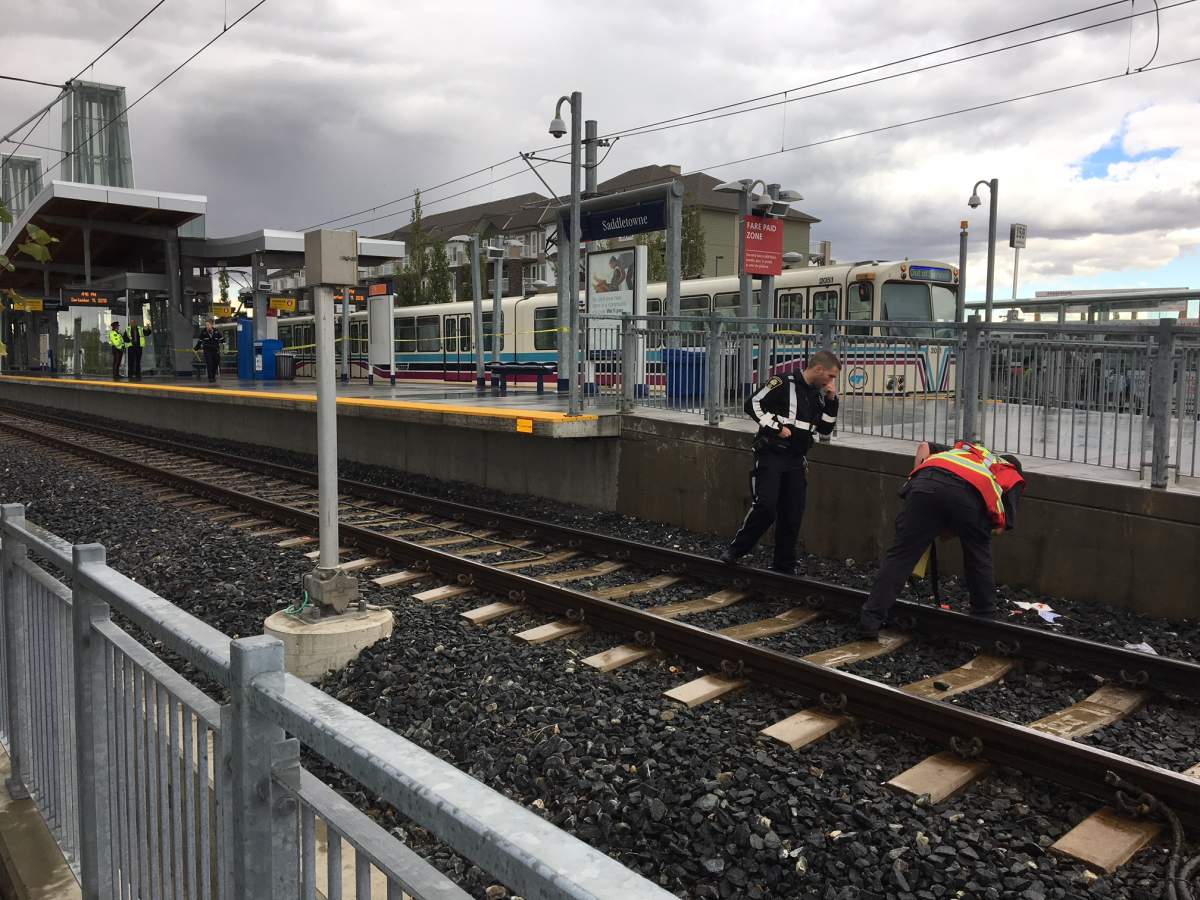 Officials on the scene of a pedestrian-CTrain collision on Tuesday, Sept. 11.