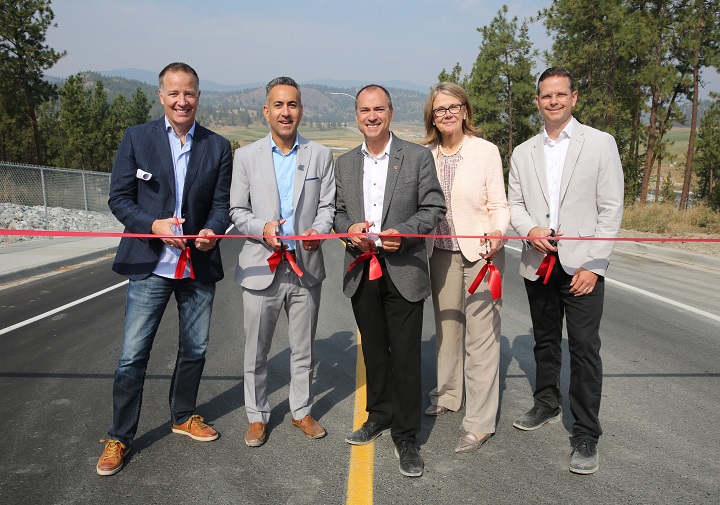 Taking part in the ribbon-cutting ceremony for John Hindle Drive were, from left, MP Stephen Fuhr, Kelowna mayor Colin Basran, MLA Norm Letnick and UBCO principal Deborah Buszard.
