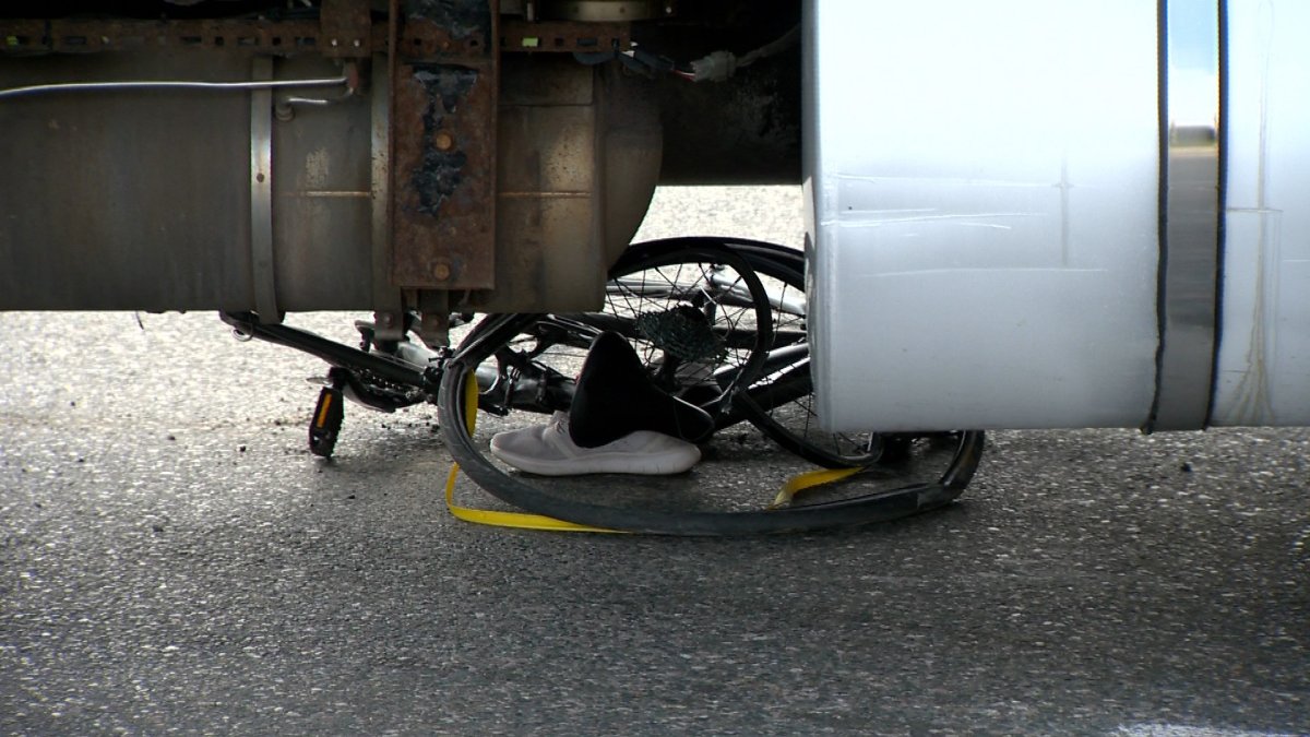 Toronto police say a cyclist has suffered life-threatening injuries after being struck by a transport truck.