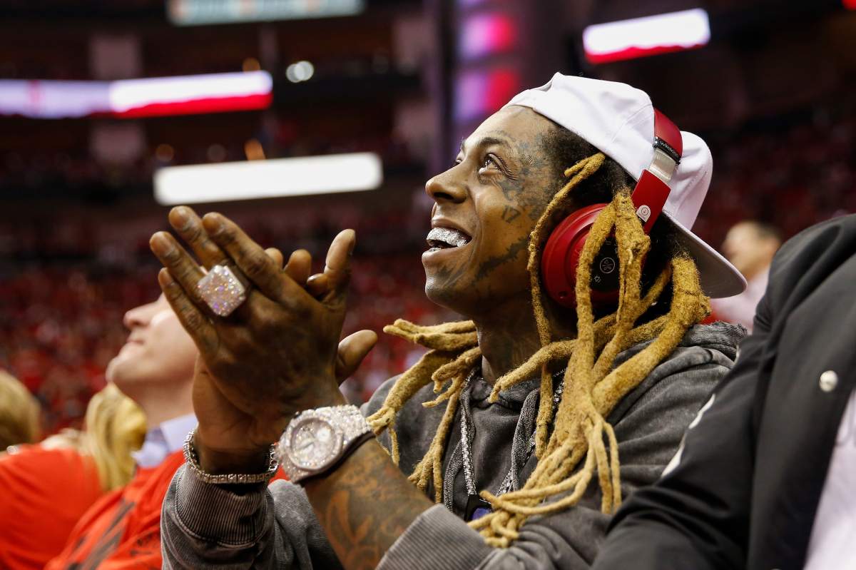 Lil Wayne applauds in the second half during Game One of the Western Conference Semifinals of the 2018 NBA Playoffs.