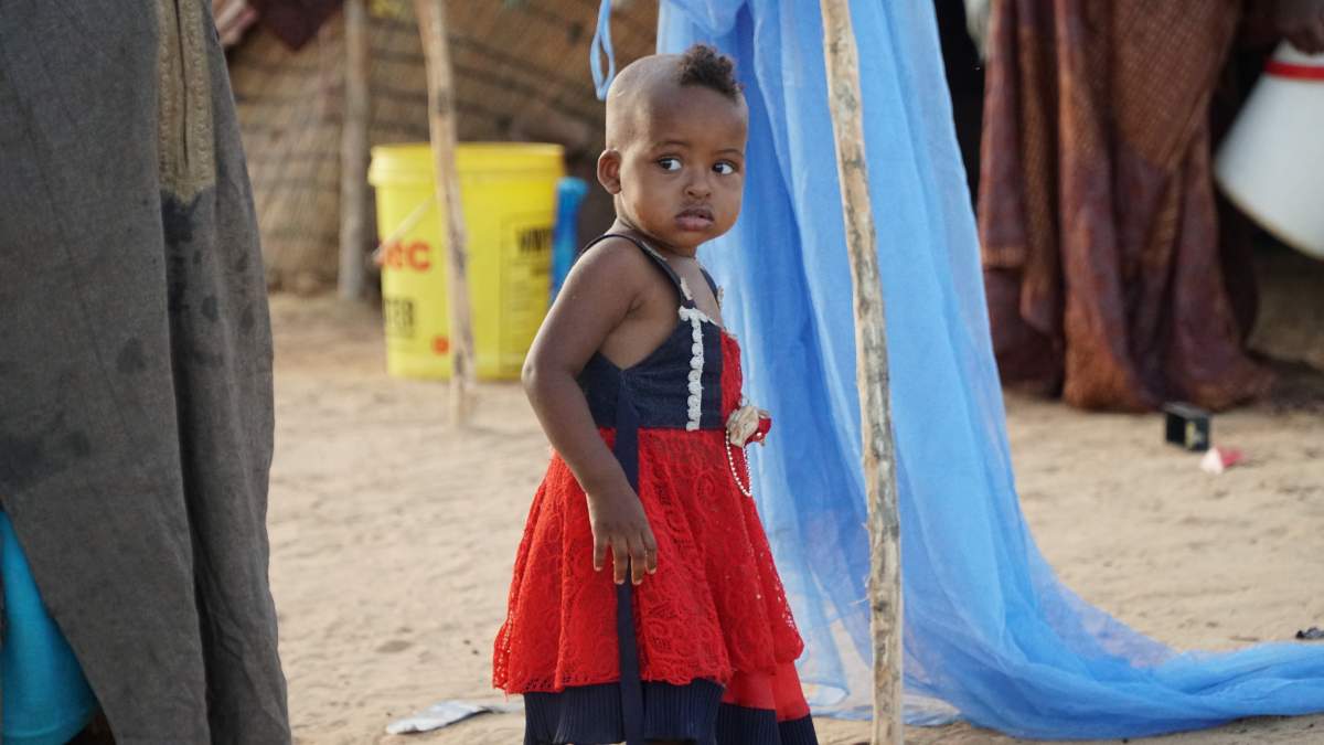 A Malian child is curious about her UN visitors. 65 per cent of Mali’s population is under the age of 25.