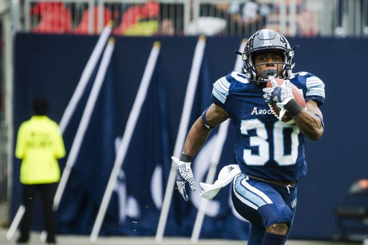 Toronto Argonauts running back Martese Jackson (30) runs in the ball during first quarter CFL action against the BC Lions, in Toronto on Saturday, August 18, 2018. 