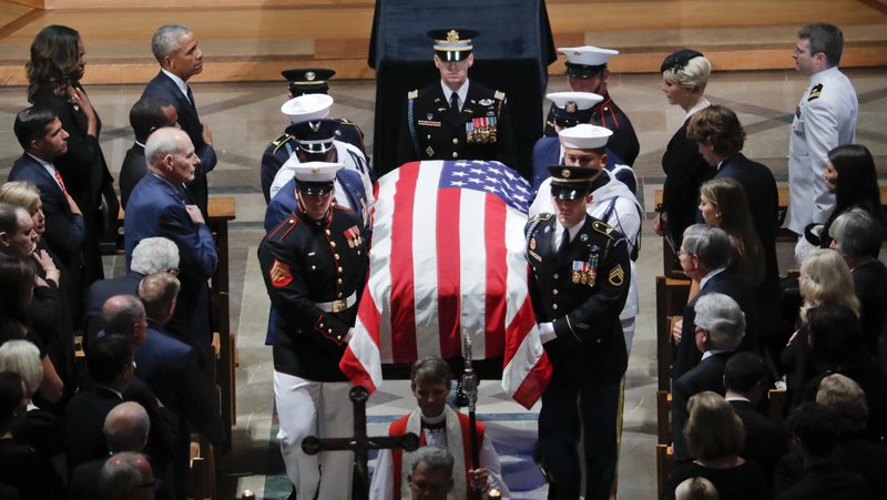 ×
John McCain, Barack Obama, Michelle Obama, John Kelly
The family of Sen. John McCain, R-Ariz., follows as his casket is carried during the recessional at the end of a memorial service at Washington National Cathedral in Washington, Saturday, Sept. 1, 2018. McCain died Aug. 25, from brain cancer at age 81. 