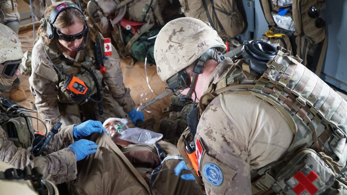 A Canadian CH-147F Chinook helicopter is deployed on a medical evacuation training exercise near Gao, Mali. The medical team includes a doctor, nurse and two medics.