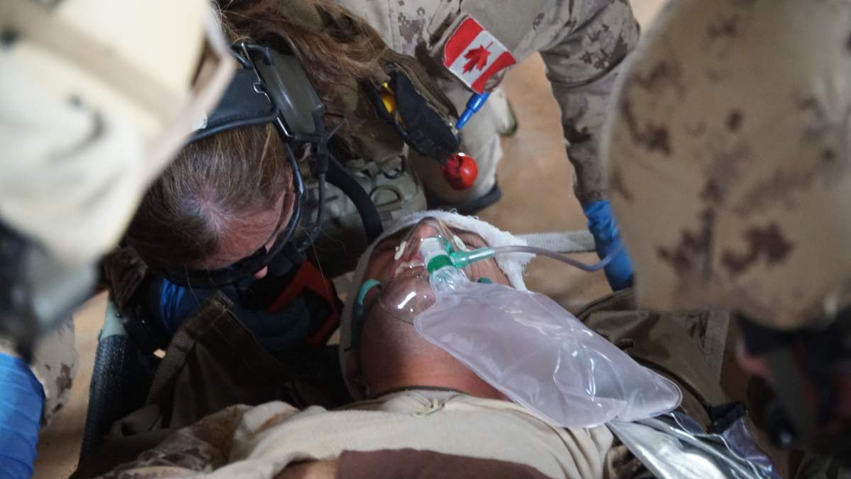 A Canadian CH-147F Chinook helicopter is deployed on a medical evacuation training exercise near Gao, Mali. The medical team includes a doctor, nurse and two medics.