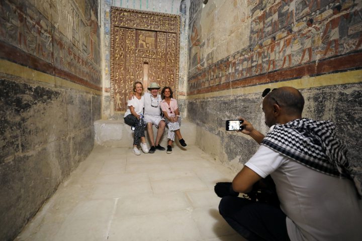 Tourists pose for a photo at a chamber of the tomb of Mehu after it was opened for the public at Saqqara area near Egypt’s Saqqara necropolis, in Giza Egypt Sept. 8, 2018.