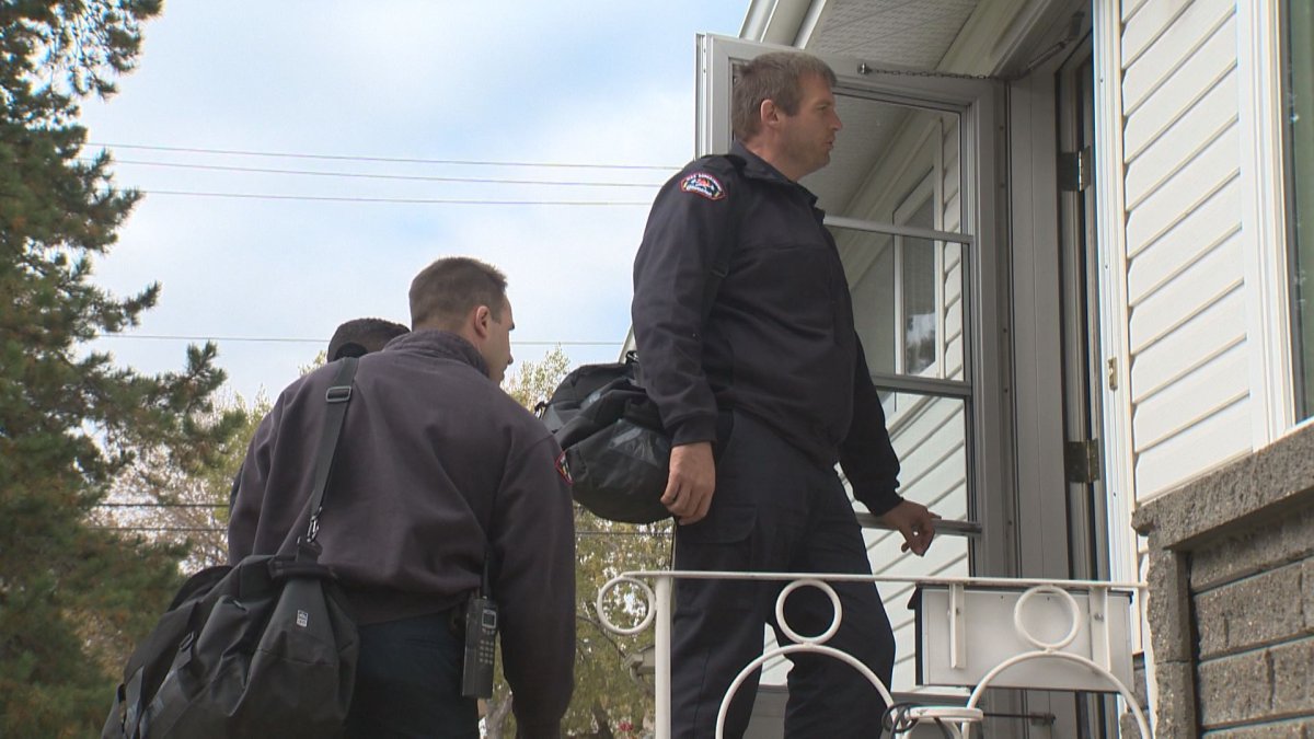 Edmonton Fire Rescue Services (EFRS) firefighters going door-to-door installing carbon monoxide and smoke detectors.