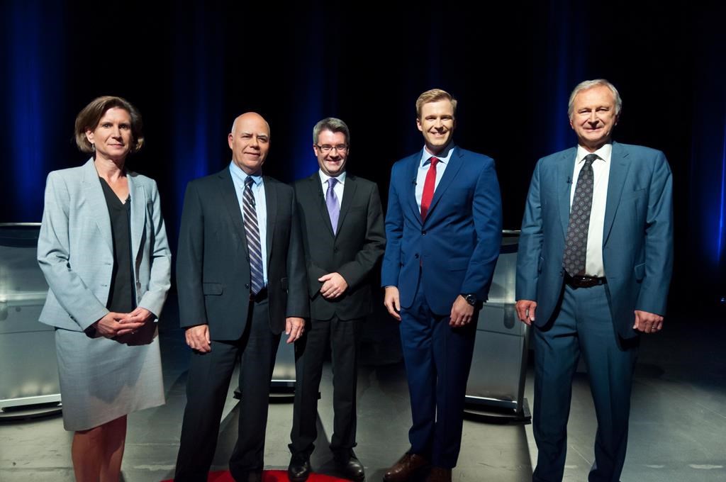 NDP Jennifer McKenzie, left to right, Green Party David Coon, People's Alliance Kris Austin, Liberal Brian Gallant, PC Blain Higgs pose for photos before the start of the New Brunswick leaders debate in Riverview, New Brunswick on Wednesday September 12, 2018. THE CANADIAN PRESS/Marc Grandmaison.