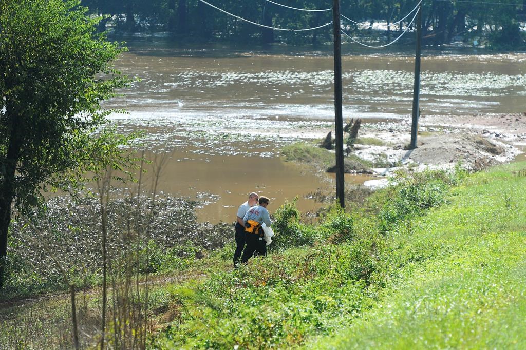 Nearly 3,000 hogs are believed to have died in flooding triggered by(02)