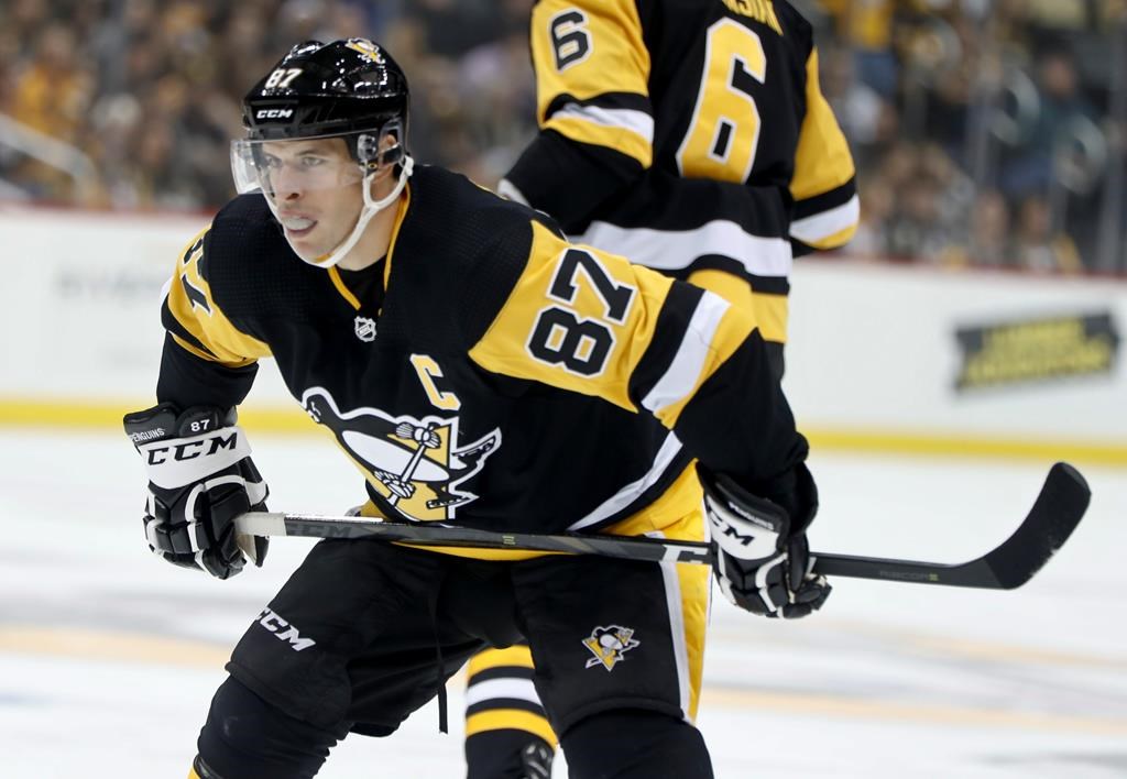 FILE - In this Sept. 22, 2018, file photo, Pittsburgh Penguins' Sidney Crosby plays against the Columbus Blue Jackets during an NHL preseason hockey game, in Pittsburgh. The Eastern Conference is full of a mix of new challengers like Toronto and the familiar cast of contenders from Pittsburgh to Boston to Tampa Bay.(AP Photo/Keith Srakocic, File).