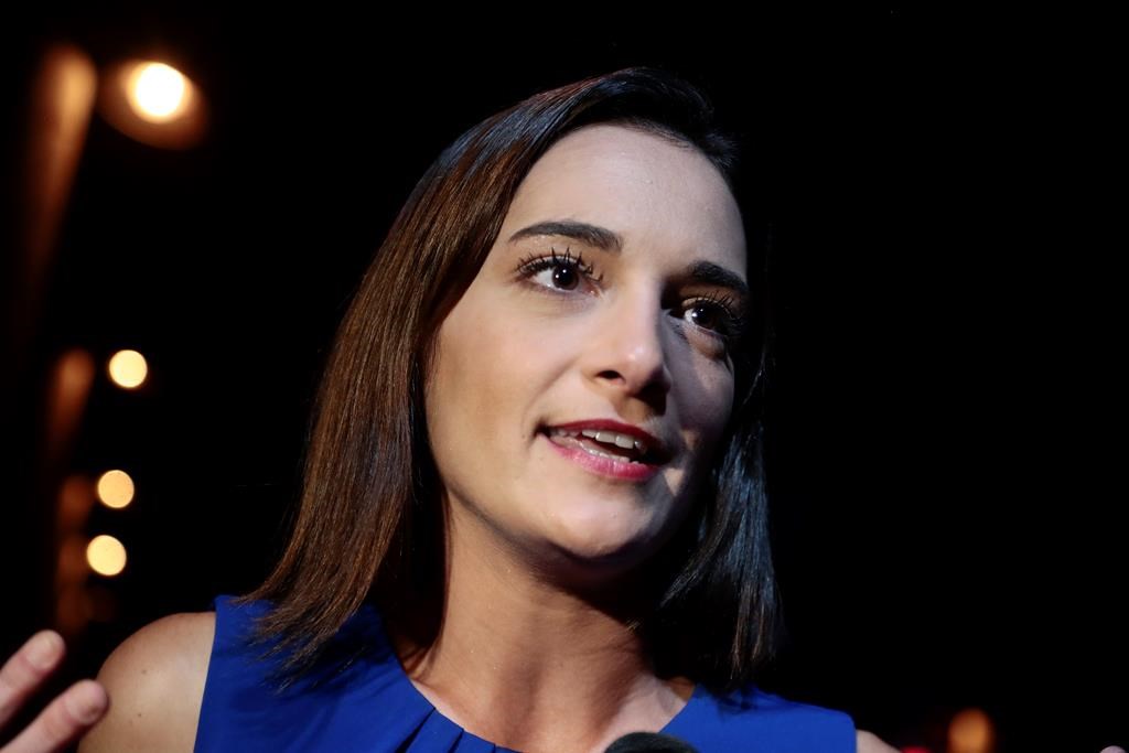 Julia Salazar answers questions during an interview after winning the Democratic primary over Martin Dilan in New York's 18th State Senate district race, Thursday, Sept. 13, 2018, in New York.