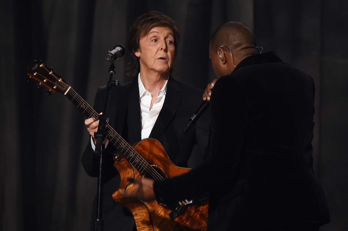 Paul McCartney and Kanye West perform onstage during The 57th Annual GRAMMY Awards in Los Angeles, California.