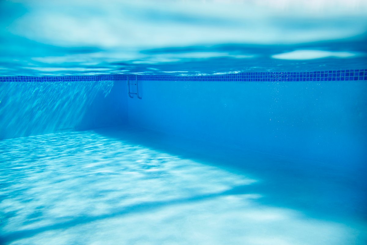 The underwater view of a swimming pool.