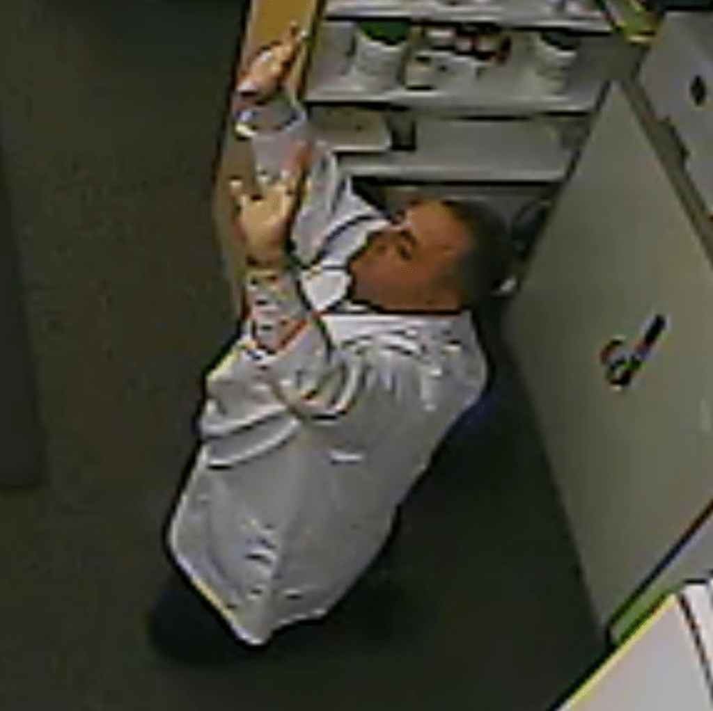 Waseem Shaheen seen in surveillance video during a knifepoint robbery at his Ottawa pharmacy in October 2014. (Global News)