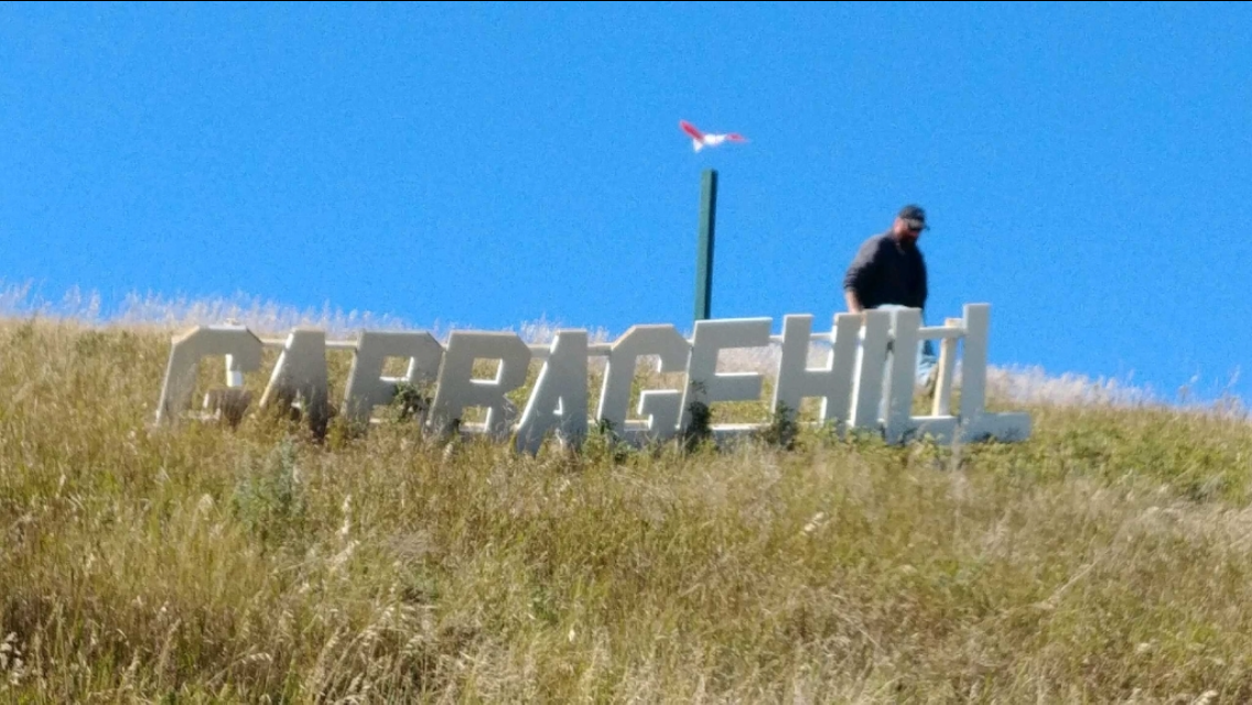 A city worker removes the sign Monday afternoon. Michael Draven/Global News