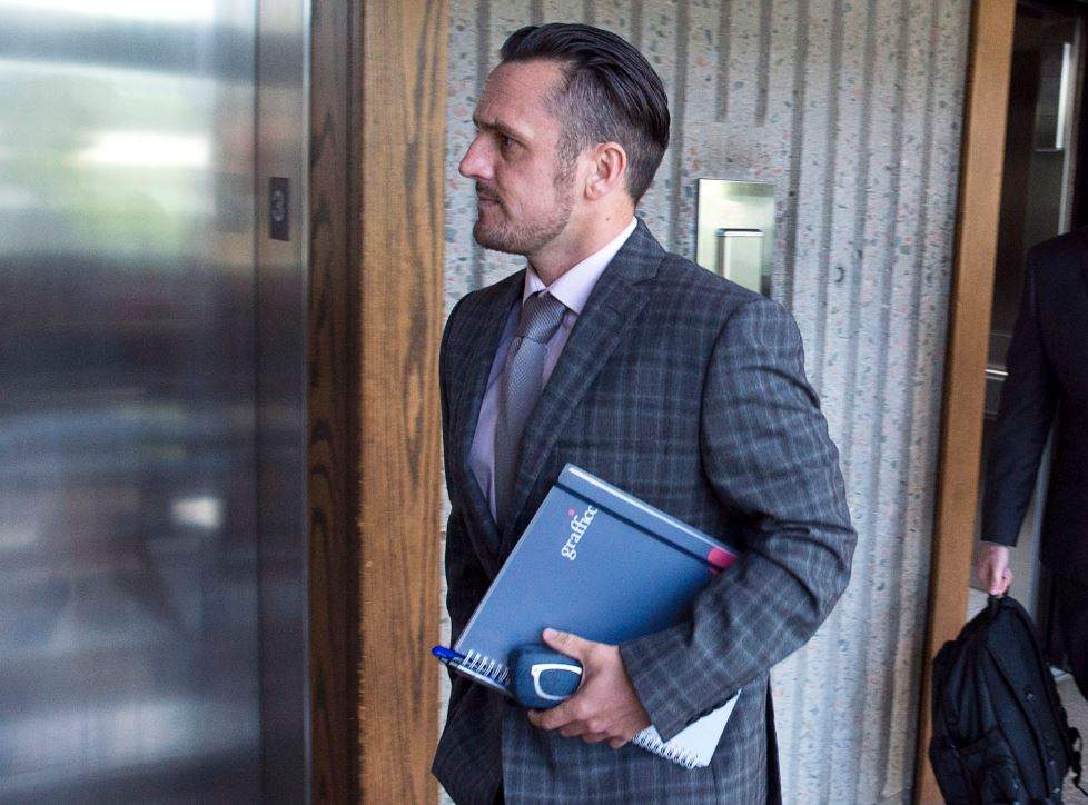 Simon Radford, a British sailor charged with sexual assault causing bodily harm, walks outside the court room in Nova Scotia Supreme Court in Halifax on Wednesday, Sept. 5, 2018. Fellow sailor Darren Smalley also facing charges in the incident. 