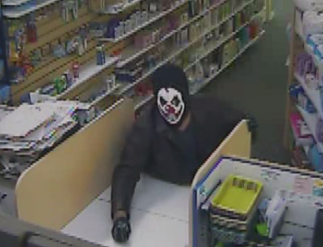 A man caught on surveillance video acting out what appeared to be a robbery at a pharmacy in B.C.