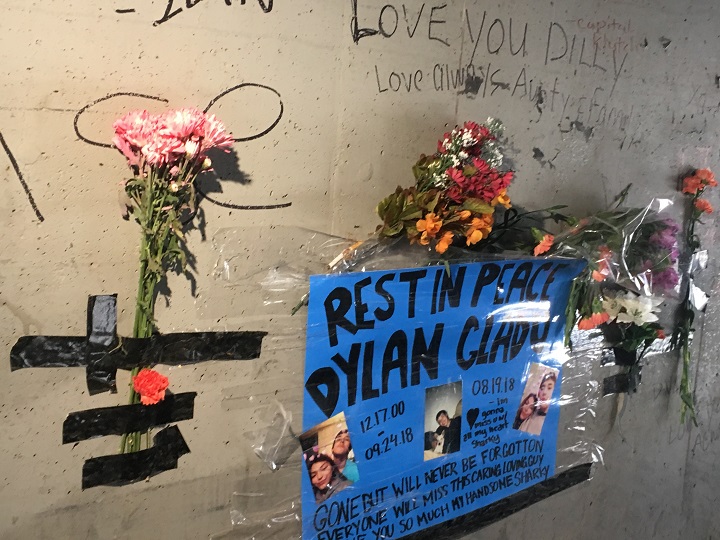 A memorial is visible at the railway underpass on McPhillips Street near Logan Avenue for a 17-year-old boy who police say was stabbed to death.