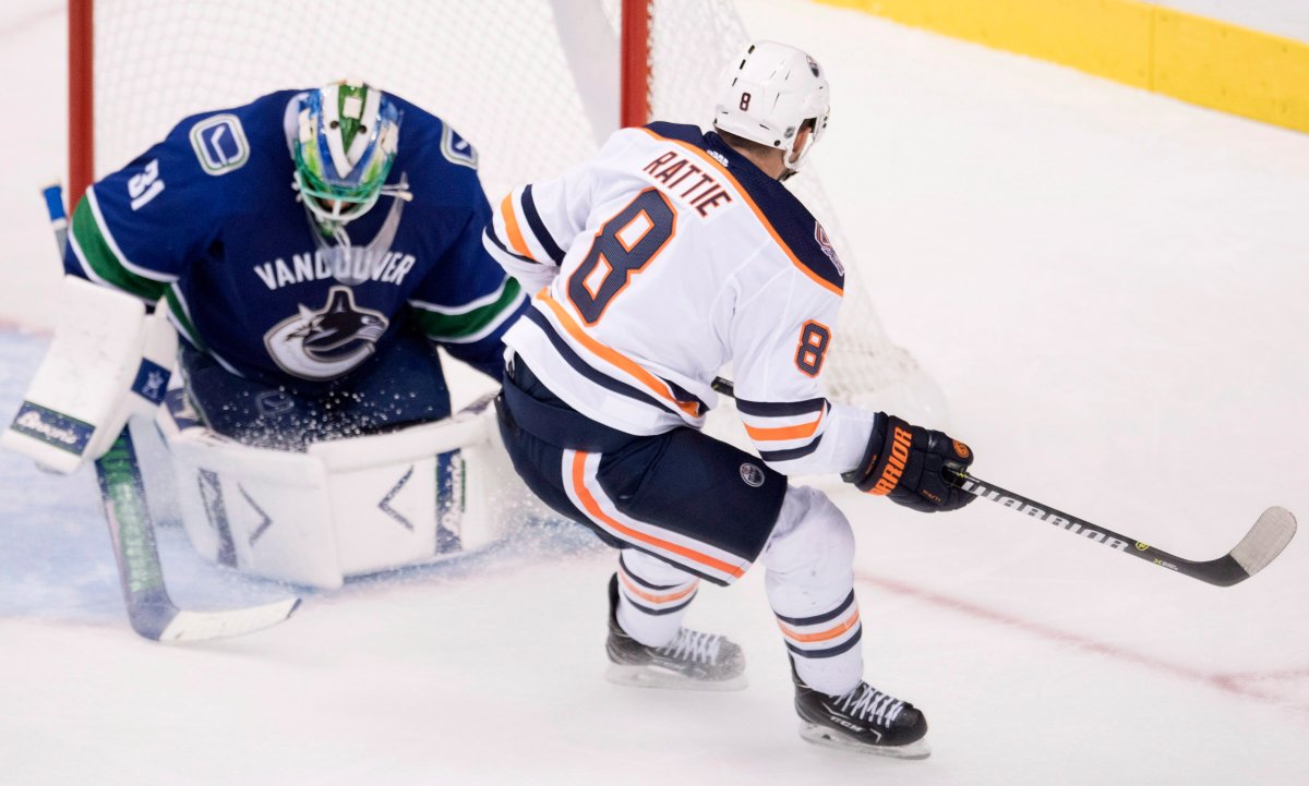 Edmonton Oilers right wing Ty Rattie (8) sends a shot past Vancouver Canucks goaltender Anders Nilsson (31) during third period NHL pre-season action at Rogers Arena in Vancouver, Tuesday, Sept, 18, 2018.