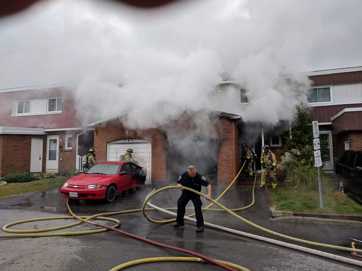 Ottawa firefighters battle a blaze at a home at 191 Birch Hill Private in Vanier on Thursday morning.