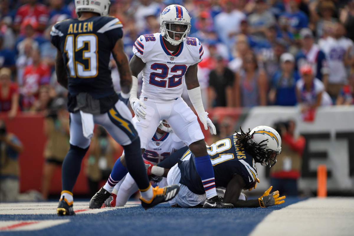 Buffalo Bills' Vontae Davis, center, gets up after Los Angeles Chargers' Mike Williams, right, scores a touchdown during the first half of an NFL football game, Sunday, Sept. 16, 2018, in Orchard Park, N.Y.