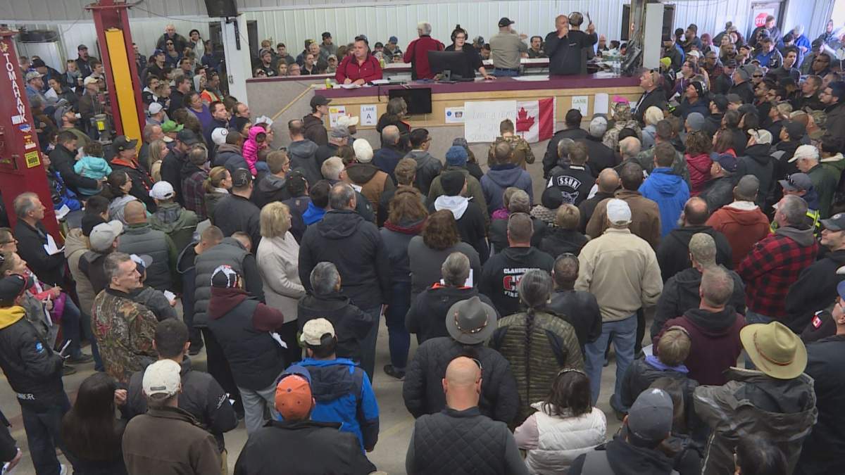 In this file photo, bargain hunters flood a Headingley auction house for the police unclaimed goods auction. 