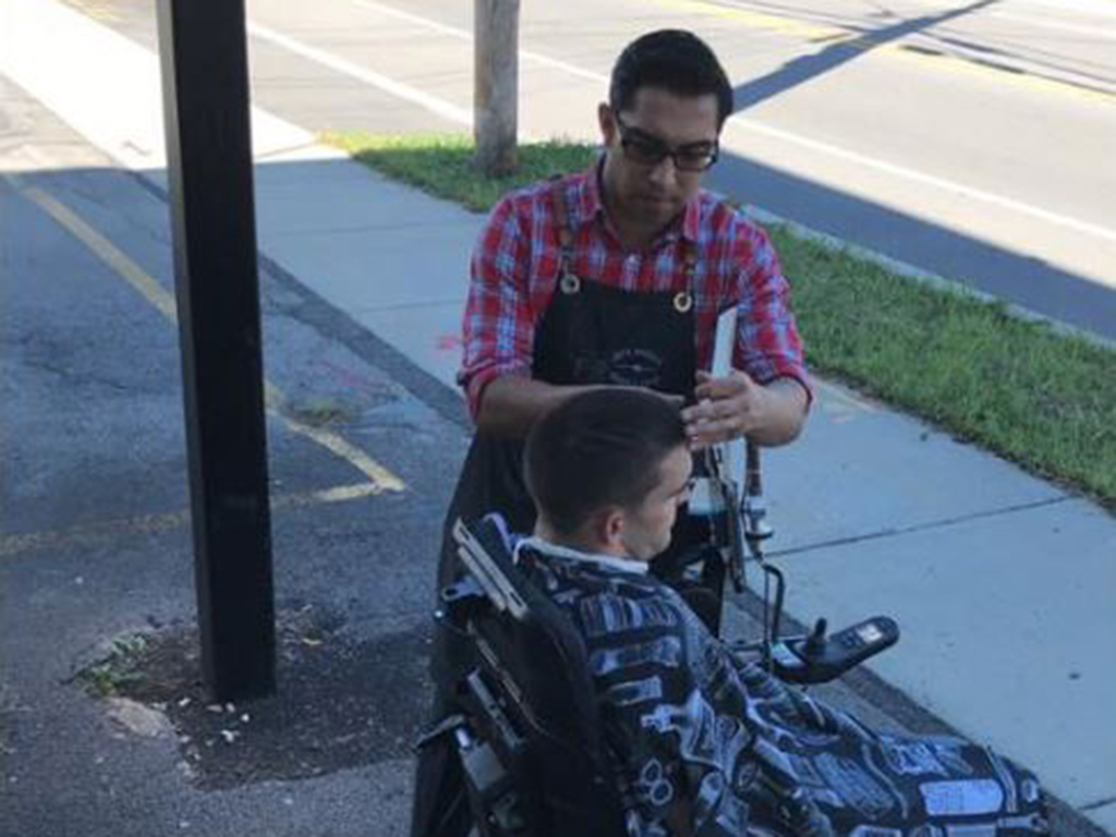 Victor Burgos didn't think twice about going outside to cut a client's hair because his shop isn't wheelchair-accessible. 